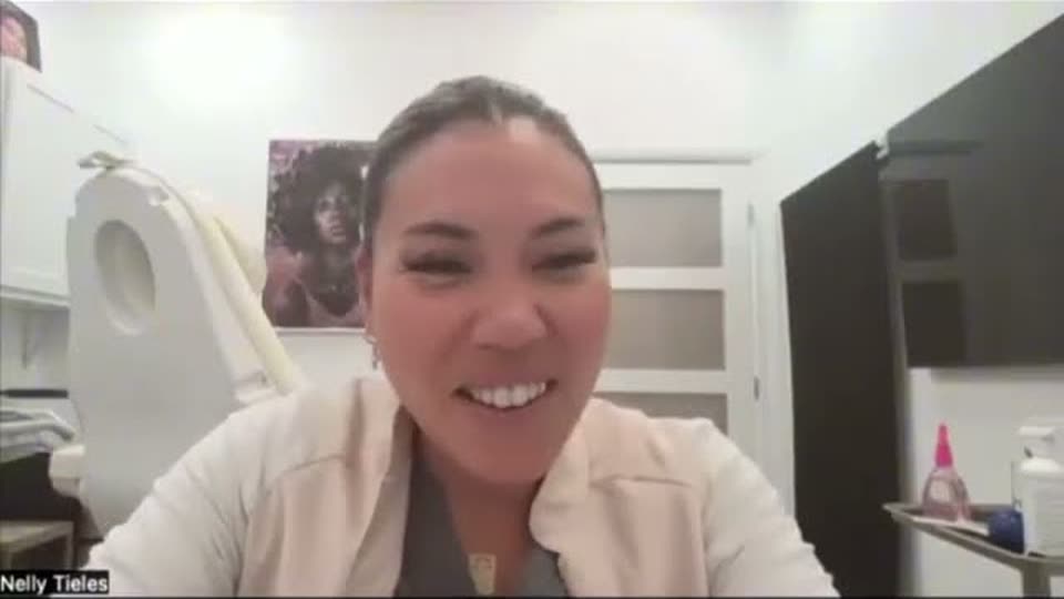 A med spa owner speaking on a video call