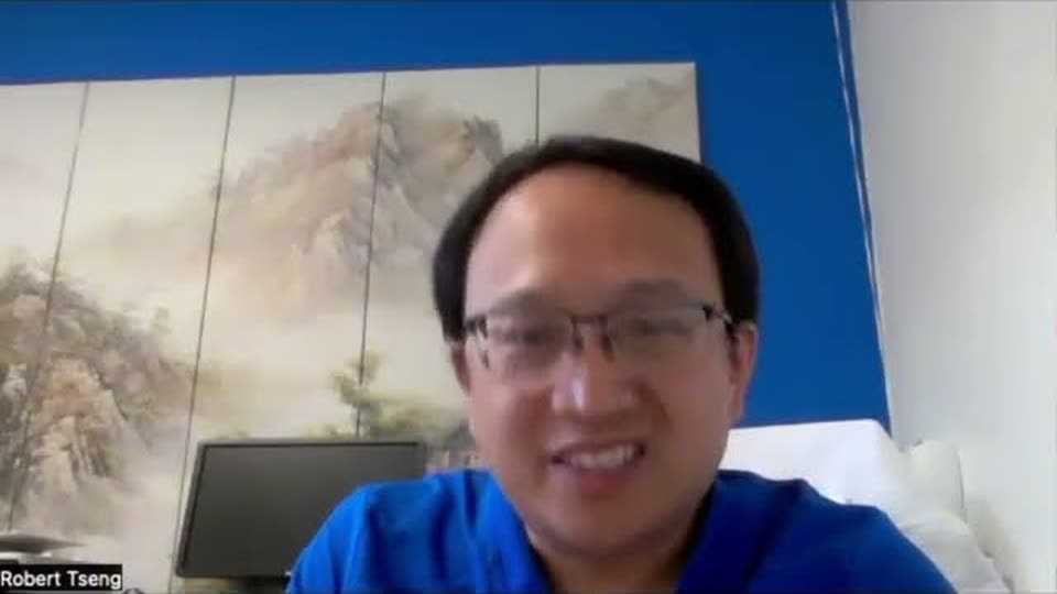 A chiropractor speaking on a video call